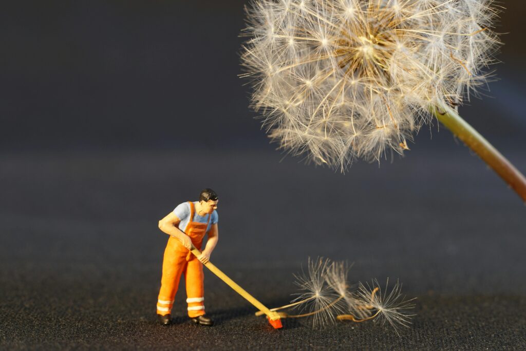 pexels-photo-434163-434163 Shallow Focus Photo of Man Holding Floor Brush Ceramic Figurine